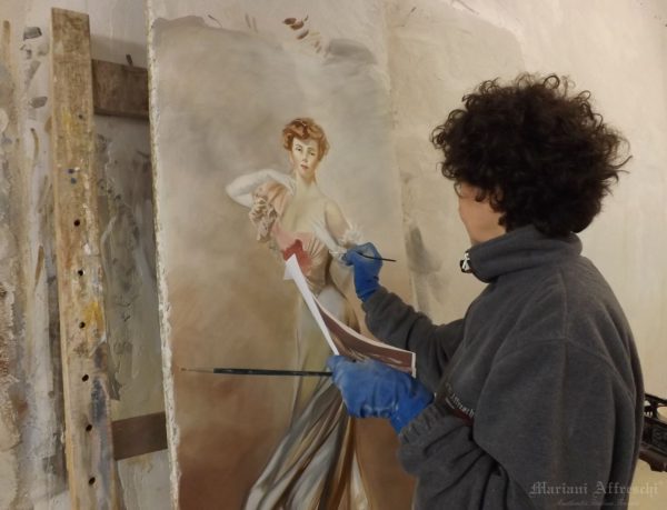 Our Master of Art working on a frescoed portrait of a Lady inspired by Giovanni Boldini
